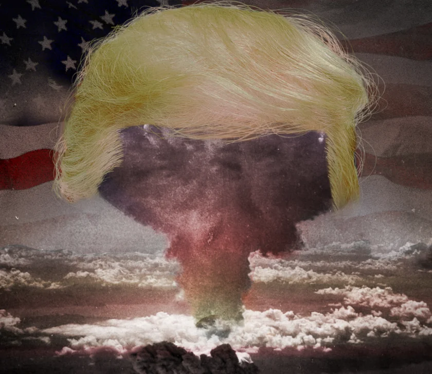A nuclear mushroom cloud wearing a giant Trump wig. A decaying American flag fills the sky behind it.